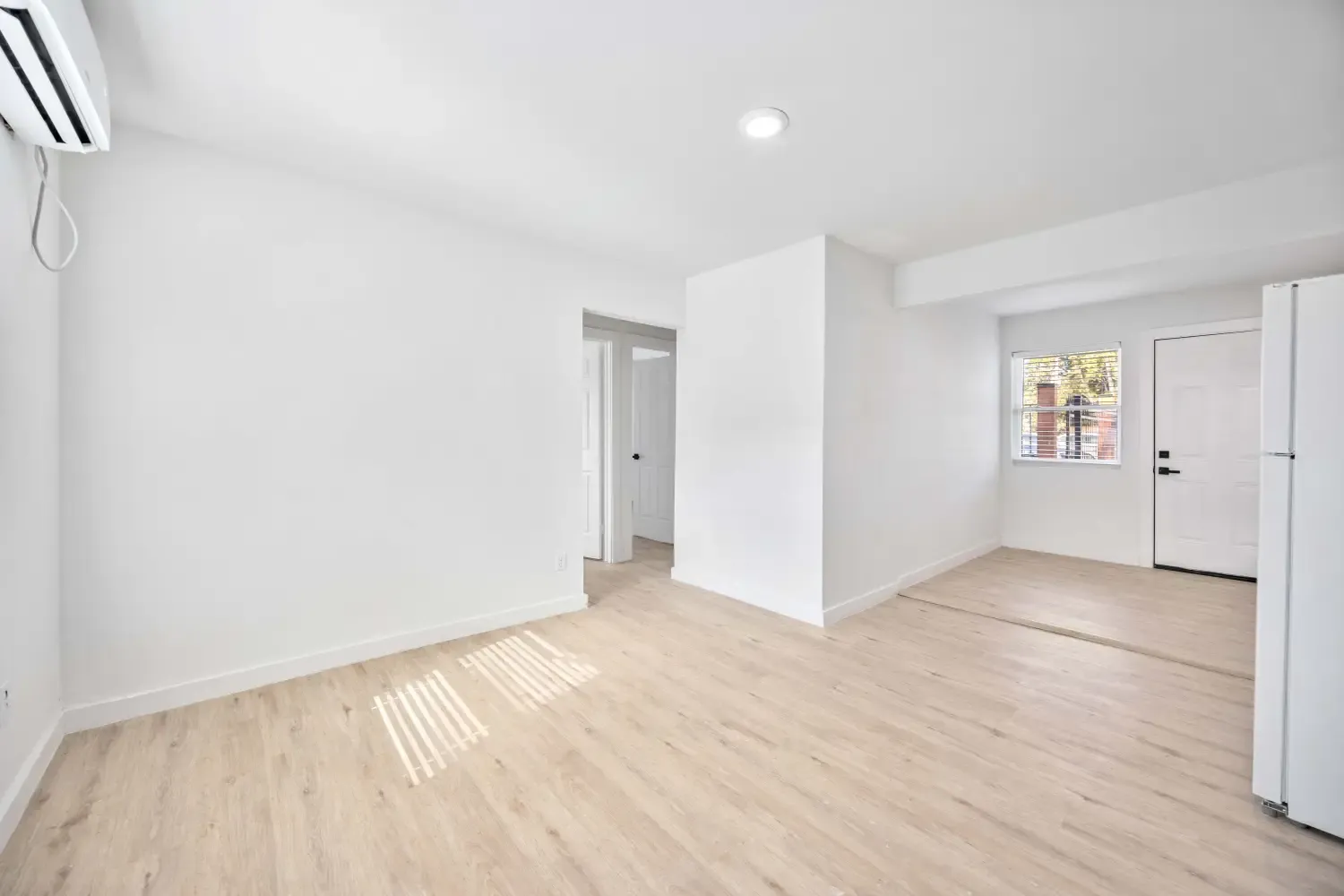 Bright living area with vinyl plank flooring