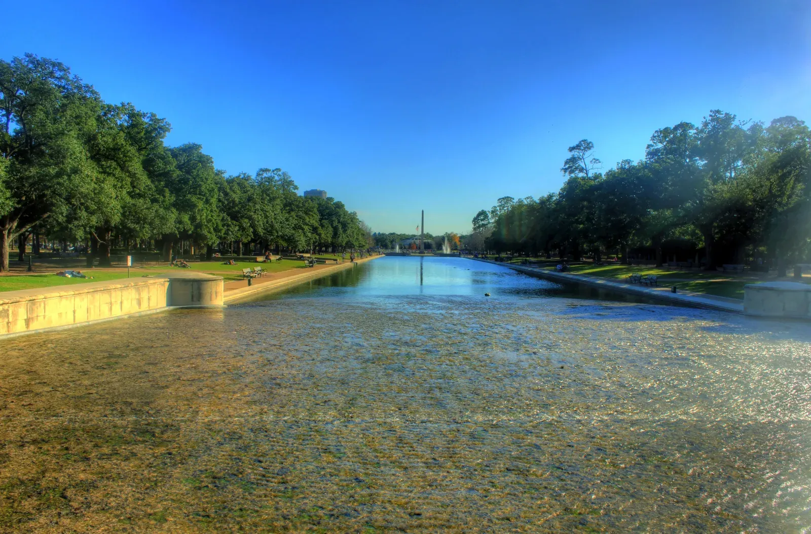 Hermann Park reflection pool lined with trees
